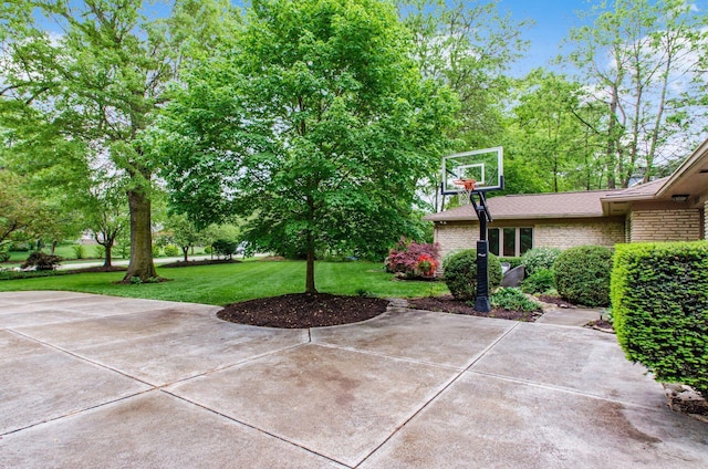 view of patio / terrace with basketball hoop