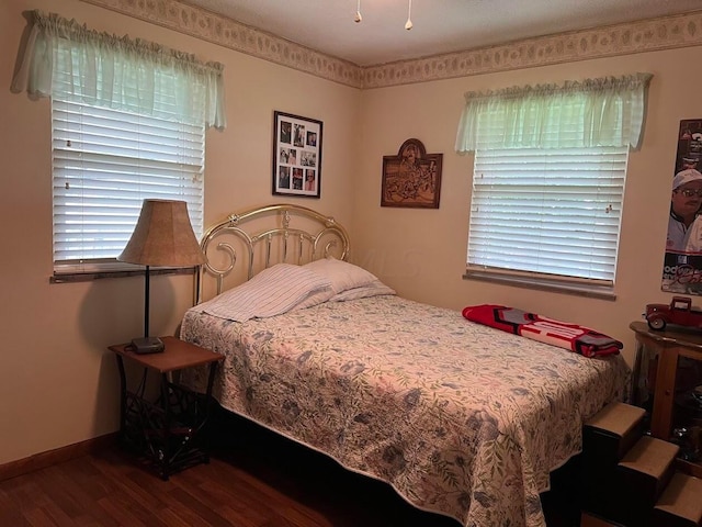 bedroom with wood-type flooring