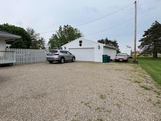 view of side of home with an outdoor structure and a garage