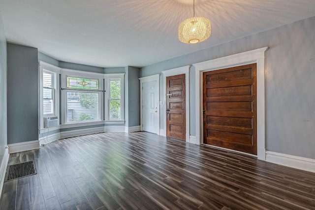 interior space with cooling unit and dark wood-type flooring