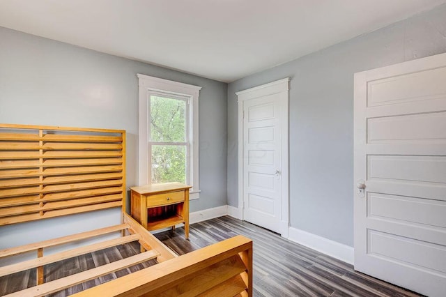 bedroom featuring dark hardwood / wood-style floors