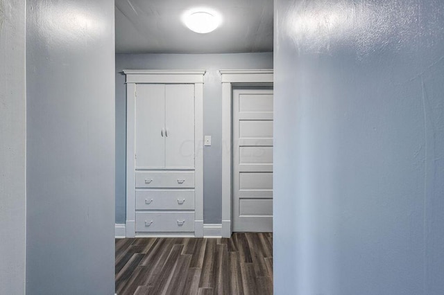 hall with dark hardwood / wood-style flooring