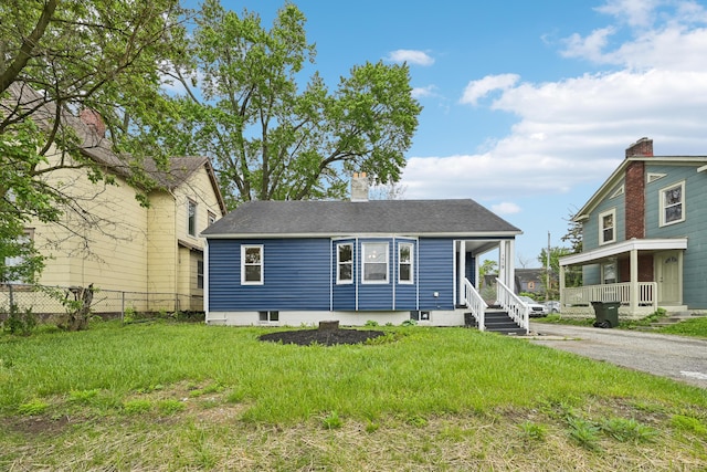 view of front of house featuring a front yard and a porch