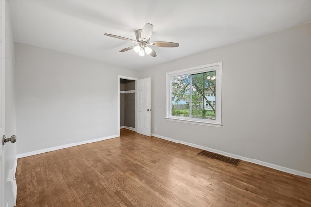 unfurnished bedroom with hardwood / wood-style floors and ceiling fan