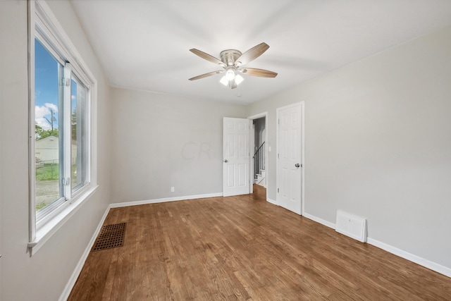 unfurnished room featuring hardwood / wood-style floors and ceiling fan