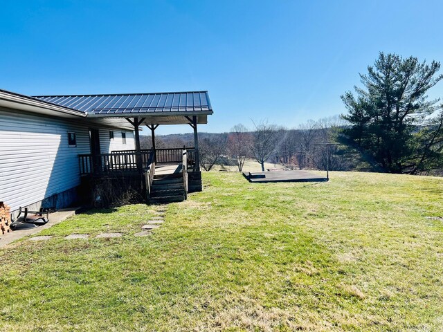 view of yard featuring a wooden deck