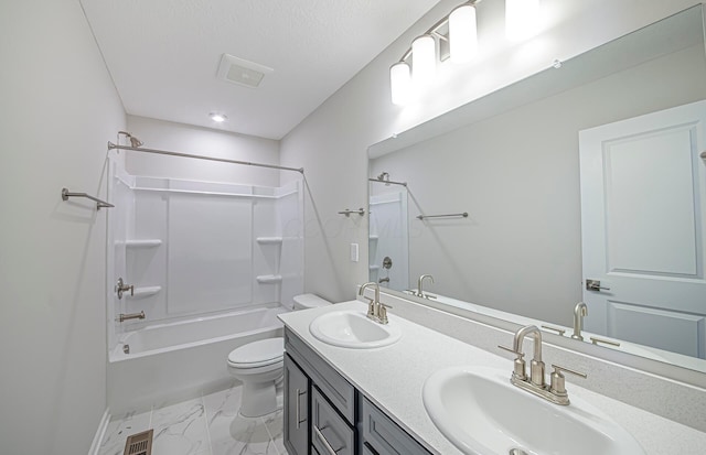 bathroom featuring toilet, a sink,  shower combination, and visible vents