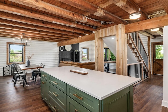 kitchen with dark hardwood / wood-style flooring, a center island, green cabinets, and wooden ceiling