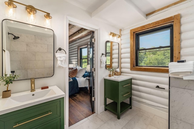 bathroom with hardwood / wood-style floors, rustic walls, and plenty of natural light