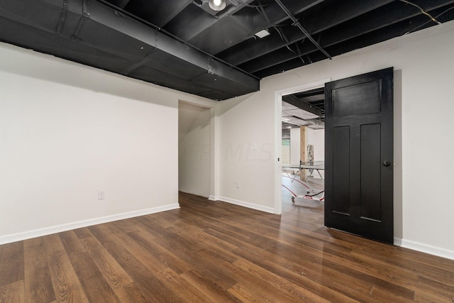 basement featuring dark wood-type flooring