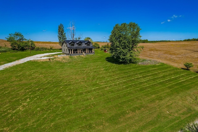 view of yard with a rural view