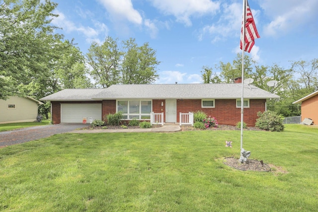 ranch-style house with a front lawn and a garage