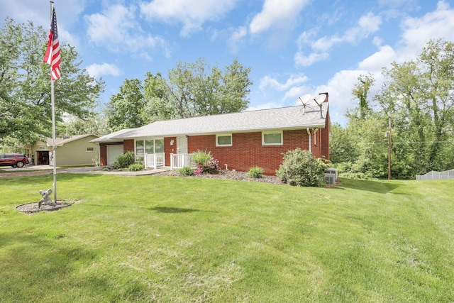 ranch-style home featuring a front yard