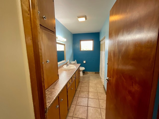 bathroom with tile patterned floors, vanity, and toilet