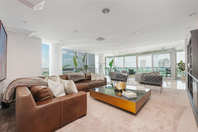 living room featuring plenty of natural light and a wall of windows