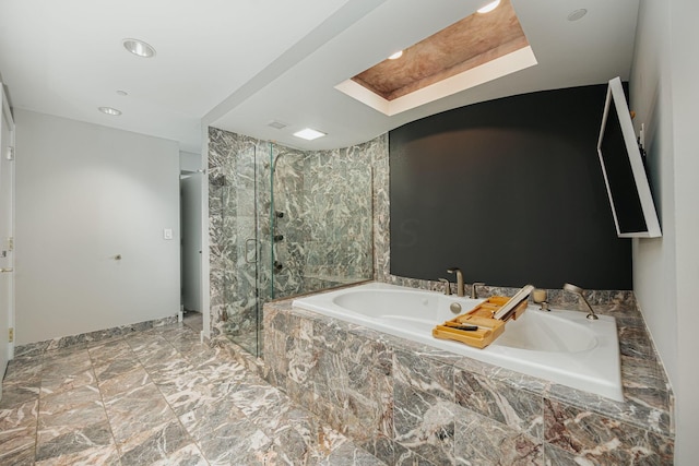 bathroom featuring shower with separate bathtub