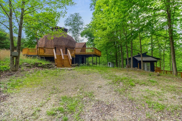 view of yard featuring a wooden deck