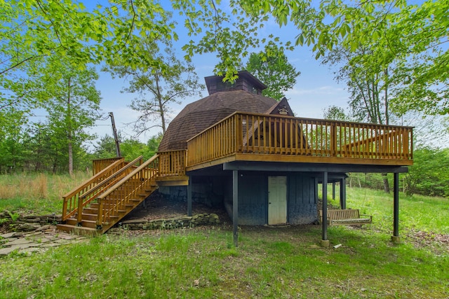 rear view of house with a wooden deck