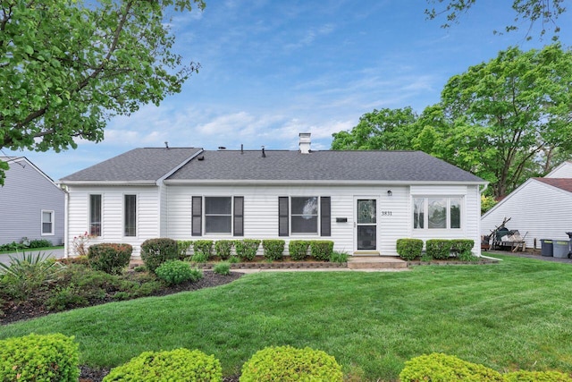 single story home featuring a front yard