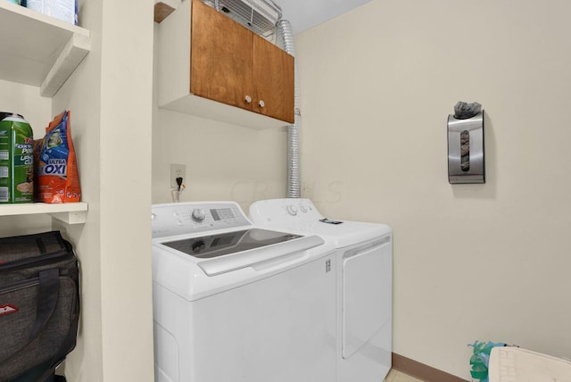 clothes washing area with independent washer and dryer