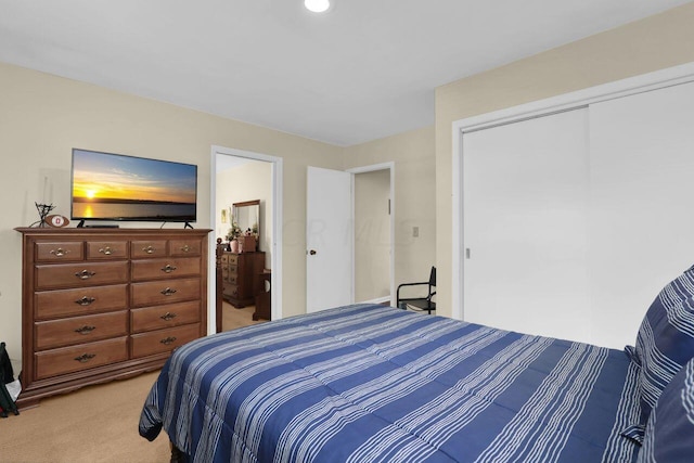 carpeted bedroom with a closet