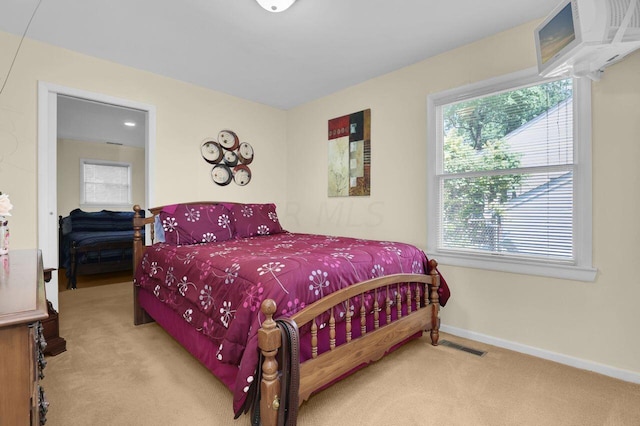 bedroom featuring light carpet