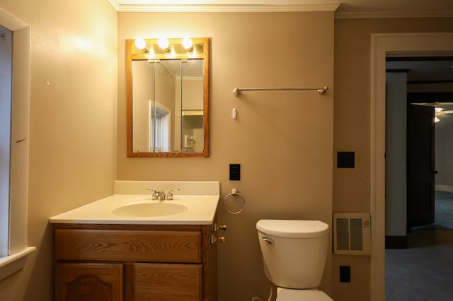 bathroom featuring vanity, toilet, and crown molding