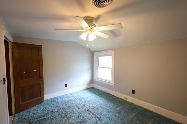 unfurnished bedroom with carpet flooring, ceiling fan, and vaulted ceiling