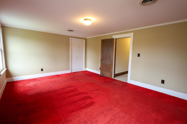 spare room with ornamental molding and light carpet