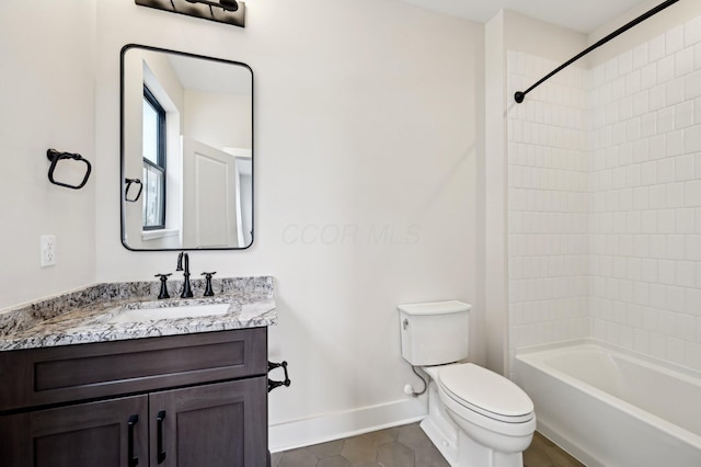 full bathroom with vanity, tiled shower / bath, tile patterned floors, and toilet