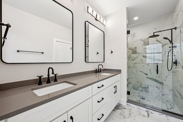 bathroom with walk in shower and vanity