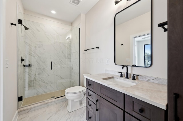 bathroom with vanity, toilet, and walk in shower