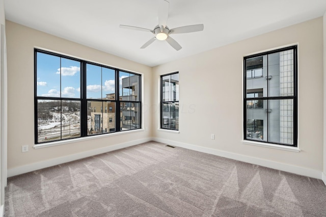 carpeted empty room with ceiling fan