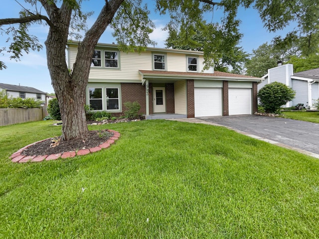 front facade featuring a front lawn and a garage