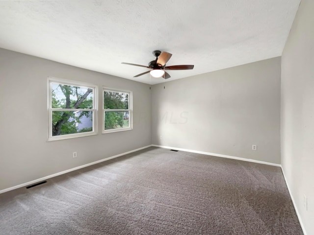 unfurnished room with carpet floors and ceiling fan