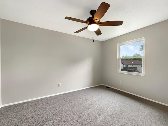 unfurnished room with ceiling fan and carpet floors