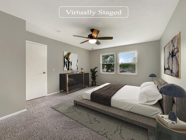 bedroom with ceiling fan and carpet floors