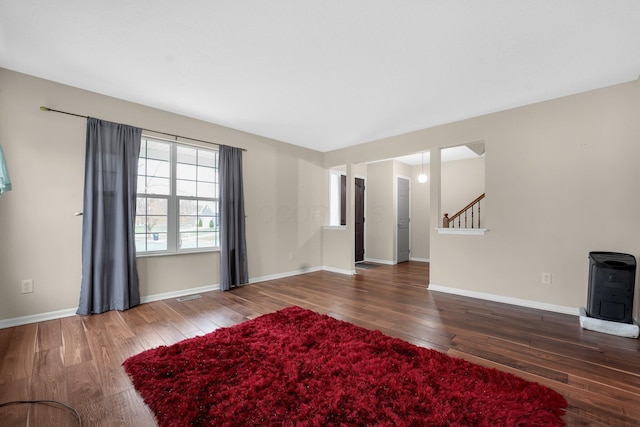 unfurnished living room featuring hardwood / wood-style floors