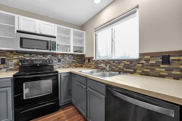 kitchen with white cabinetry, sink, stainless steel appliances, dark hardwood / wood-style floors, and gray cabinets