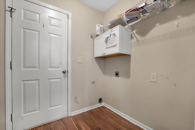 laundry area with dark hardwood / wood-style floors and hookup for an electric dryer