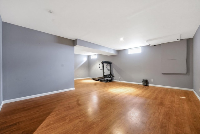 exercise room featuring hardwood / wood-style floors