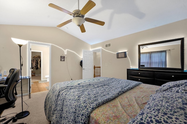 carpeted bedroom featuring ceiling fan and vaulted ceiling