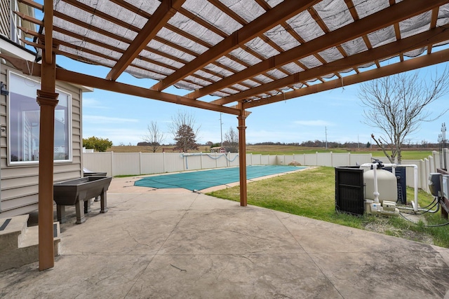 view of swimming pool featuring a yard, a patio, and a pergola