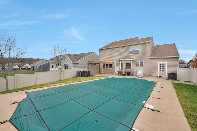 view of swimming pool with a patio area and central AC unit