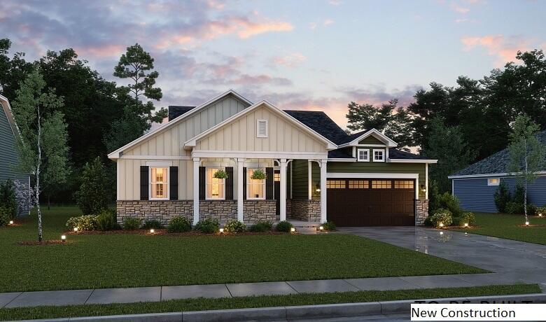 craftsman inspired home with covered porch and a yard