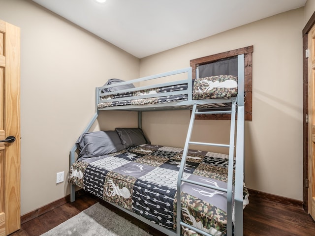 bedroom featuring dark hardwood / wood-style flooring