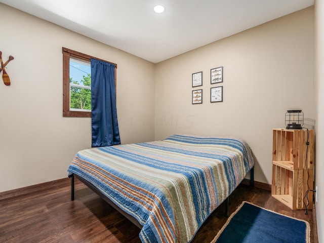 bedroom featuring dark hardwood / wood-style floors