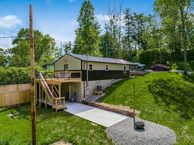 exterior space with a deck and cooling unit