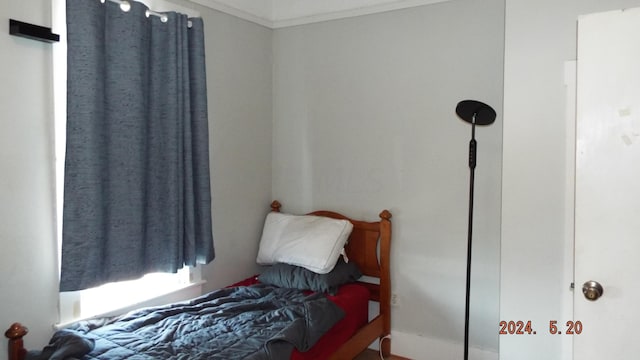 bedroom featuring ornamental molding