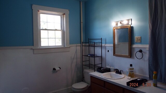 bathroom featuring vanity and toilet